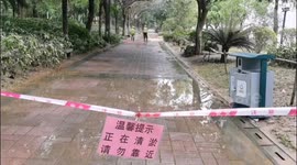China: Sanitation Workers Remove Silt in A Jiangbin Park in Qingyuan