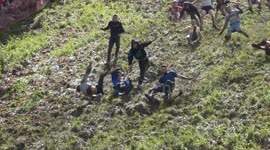 Final Men's Cheese Rolling race sees thrills and spills during downhill sprint in Gloucestershire, UK