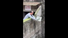 Pandas enjoying a shower