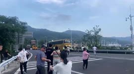 Passengers spring into action to stop sliding bus in China