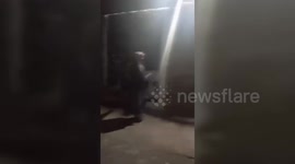 Iran: Protesters tearing the banner of Raisi's photo in Zahedan