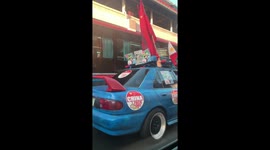 Filipino driver furnishes car with anti-China stickers and flags