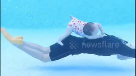 Chinese infant masters water survival skills in unique drowning prevention training