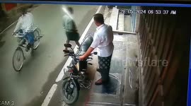 Dramatic footage shows an out of control auto hits two men talking on the side of the road