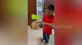 Schoolboy shows off his clever homemade cleaning robot