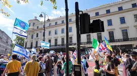 Bring Them Home shout protesters as they walk down The Strand in London