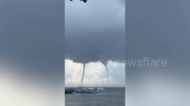 Terrifying twin waterspouts whirl off Palawan island in the Philippines