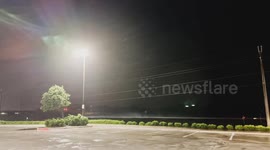 Severe Thunderstorm Winds Rock A Metal Lightpost Hard Back And Forth And Almost Blow Over A Small Tree