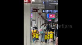 China: A Lively Group of Children on the Subway