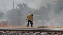 USA: Fire Department Uses Fire to Battle Fire in Heat Wave in Bakersfield