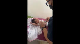 10-day-old Maria stuns with feisty gaze during doctor's exam