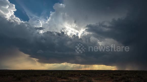 4k timelapse of storm clouds and crepuscular rays from a setting sun.