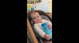 Adorable baby gets a fright and his mood spoiled after mom sneezes mid-conversation