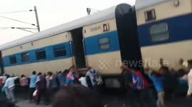 The engine and two bogies of the train caught fire , People showed their presence of mind and courage and pushed all the other bogies back in Northern India