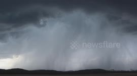Beautiful supercell near Conesville OH becoming outflow dominant with high winds and hail off in the distance.