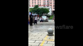 Excited student's celebration kick ends in hilarious fail outside exam hall in China