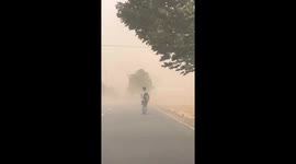 Sandstorm sweeps through  Chinese village turning sky into orange