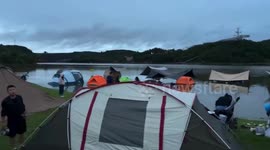 Midnight panic as tents flooded by overflowing river