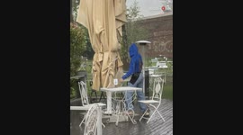 Rainy rescue mission: Girl's run to save the napkins ends in a fall