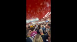 Scotland fans singing as they wait to get on the train towards the stadium