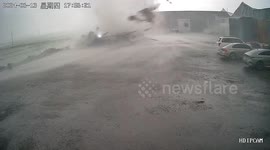 Terrifying tornado strikes northern China, sending metal fences flying through the air