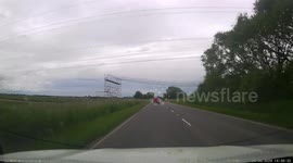 Motorist left raging as huge truck performs risky overtake on UK highway