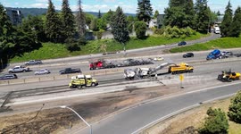 Repair crews working to fix the road after a propane tank fire on I5 at Skidmore in Portland, Oregon