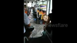 Bus engulfed by floodwater in China