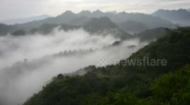 Sea of cloud flows through Chinese mountain range