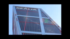 Greenpeace activists climb Madrid tower to protest TTIP