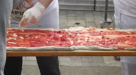 Making pizza at the world's longest pizza