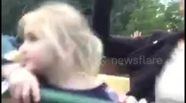 Young girl experiences a rollercoaster for the first time