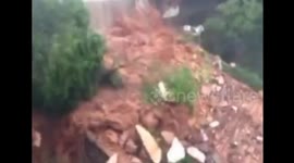 School 'wall' brought down by floodwater