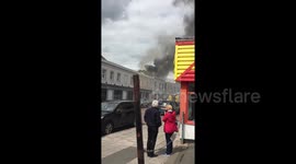 Smoke rises from restaurant on fire in Cheltenham, UK