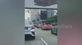 LED billboard catches fire on side of highway in Malaysia