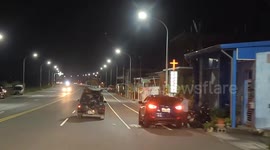 Driver spots dog standing still on moving car's roof