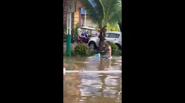 Motorcycle riders power through flooded streets in China