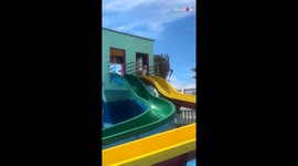 Girl changes her mind about water slide... but it's too late!