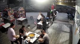 Diners leap into the air and run for their lives as huge snake enters restaurant