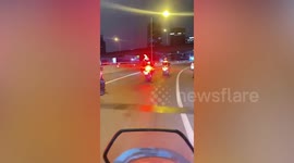 Traffic police form convoy to escort stray dog running loose on Thai motorway