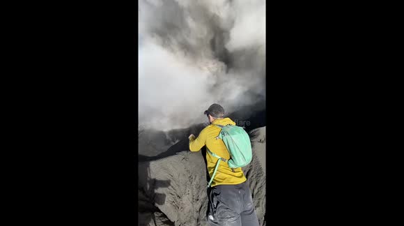 Volcano erupts as adventurers brave monsoon to summit in Indonesia