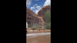 Flash floods cause waterfall on Potash Road in Moab, Utah