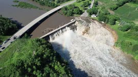 Building swept away after Minnesota dam suffers partial fail