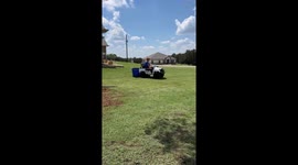 Work Smarter Not Harder Kid helps move mulch for playground using Power Wheels