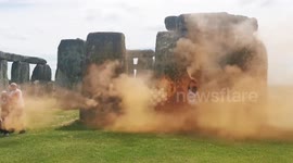 Climate activists spray Stonehenge orange in call for fossil fuel phase-out