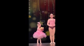 Daughter With Down Syndrome And Her Big Sister At Ballet Recital