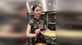 'Robot' waitress can go 15 minutes without blinking or focusing eyes