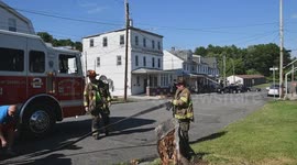 MCFD engine 2 positions a hand line while a power pole burns in the background