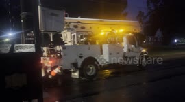multiple power utility trucks arrive