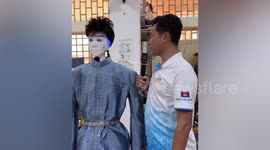 Robot tour guide converses with visitor in Cambodia